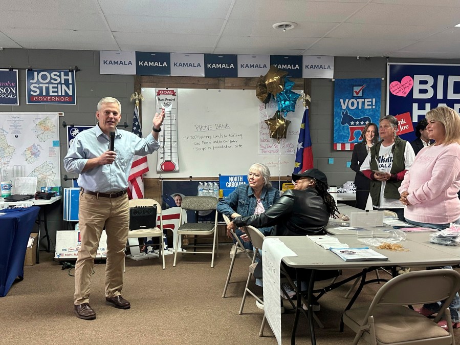 North Carolina Democratic gubernatorial nominee and state Attorney General Josh Stein, left, speaks to Johnston County Democratic Party volunteers Tuesday, Oct. 29, 2024, in Smithfield, N.C. (AP Photo/Gary D. Robertson)