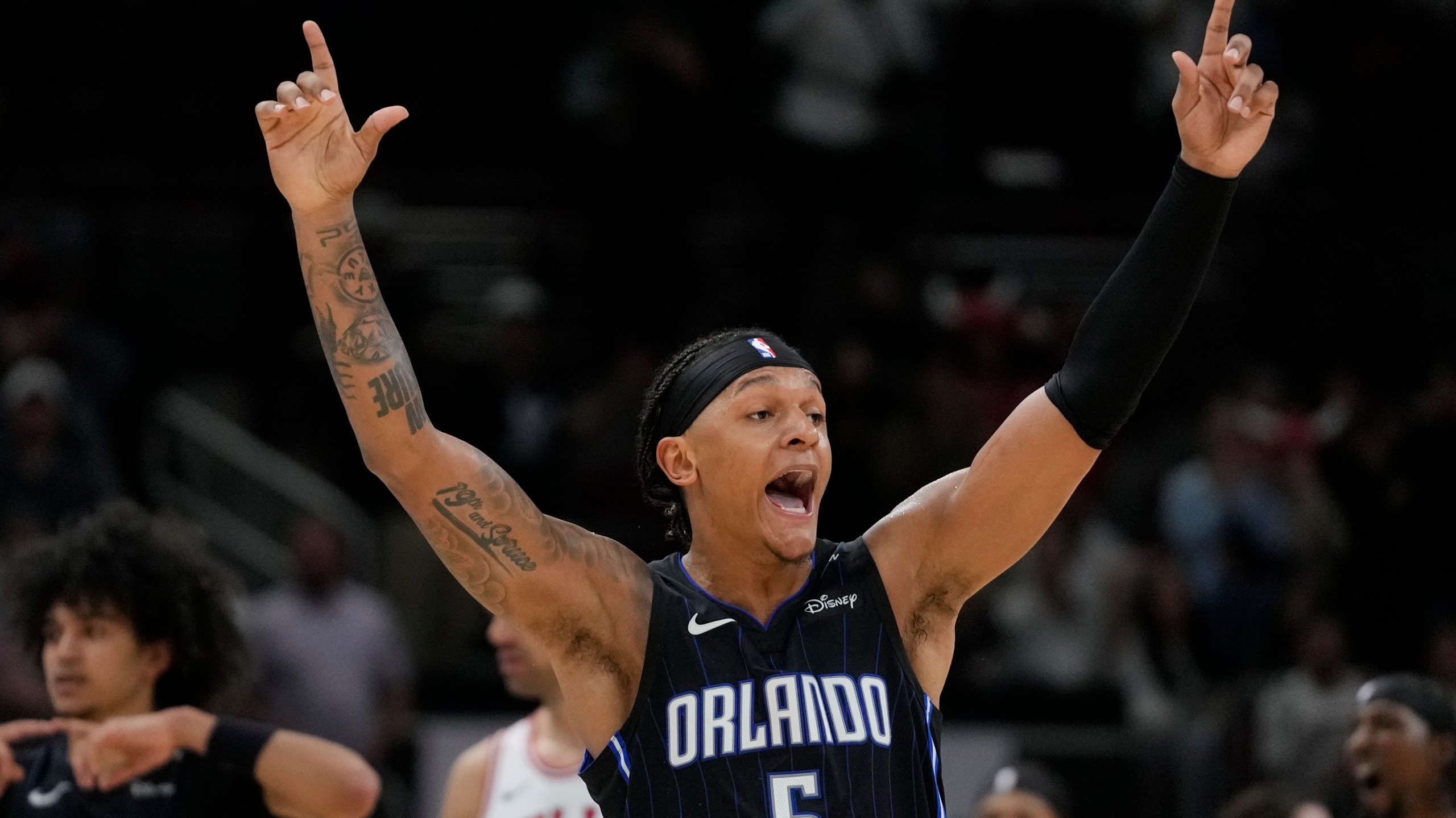 Orlando Magic forward Paolo Banchero reacts to sinking a 3-point shot before it was called no good during the second half of an NBA basketball game against the Chicago Bulls, Wednesday, Oct. 30, 2024, in Chicago. (AP Photo/Erin Hooley)