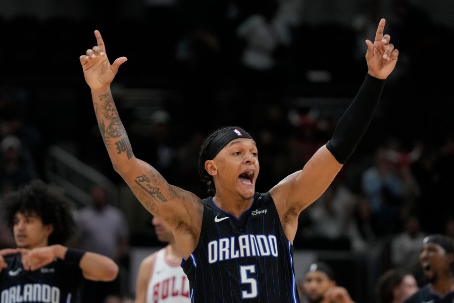 Orlando Magic forward Paolo Banchero reacts to sinking a 3-point shot before it was called no good during the second half of an NBA basketball game against the Chicago Bulls, Wednesday, Oct. 30, 2024, in Chicago. (AP Photo/Erin Hooley)