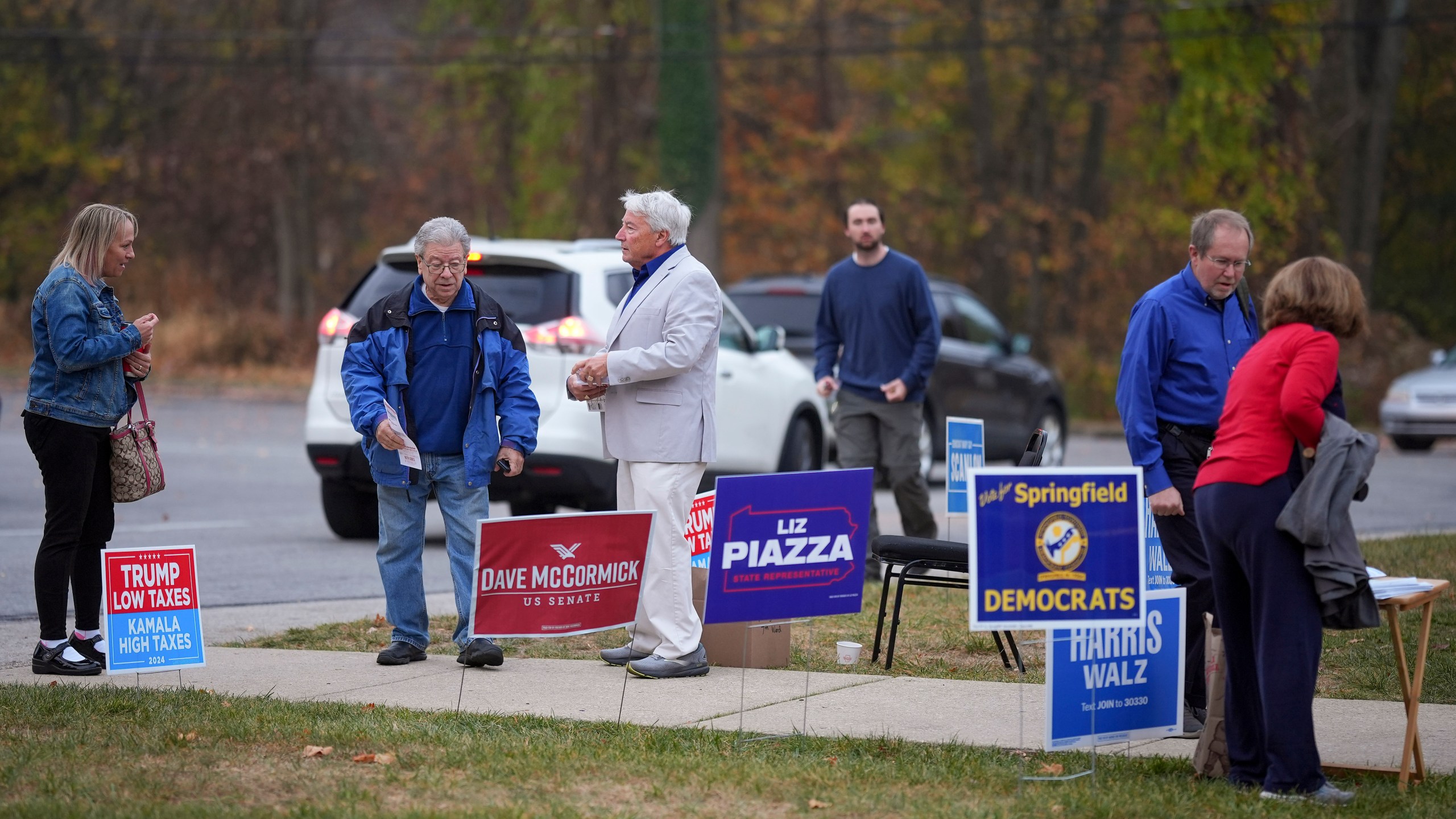 People arrive at polling place to vote, Tuesday, Nov. 5, 2024, in Springfield, Pa. (AP Photo/Matt Slocum)