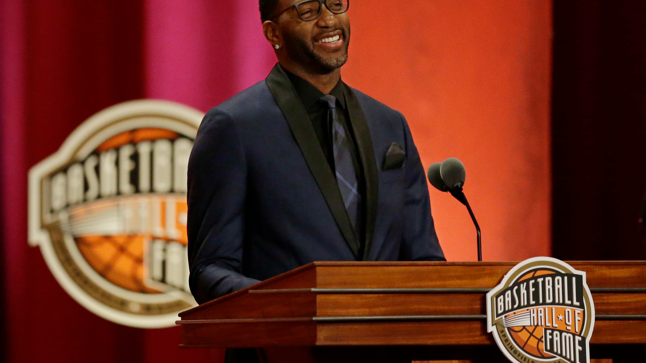 FILE - Tracy McGrady speaks during his enshrinement into the Naismith Memorial Basketball Hall of Fame, Friday, Sept. 8, 2017, in Springfield, Mass. (AP Photo/Stephan Savoia, FIle)