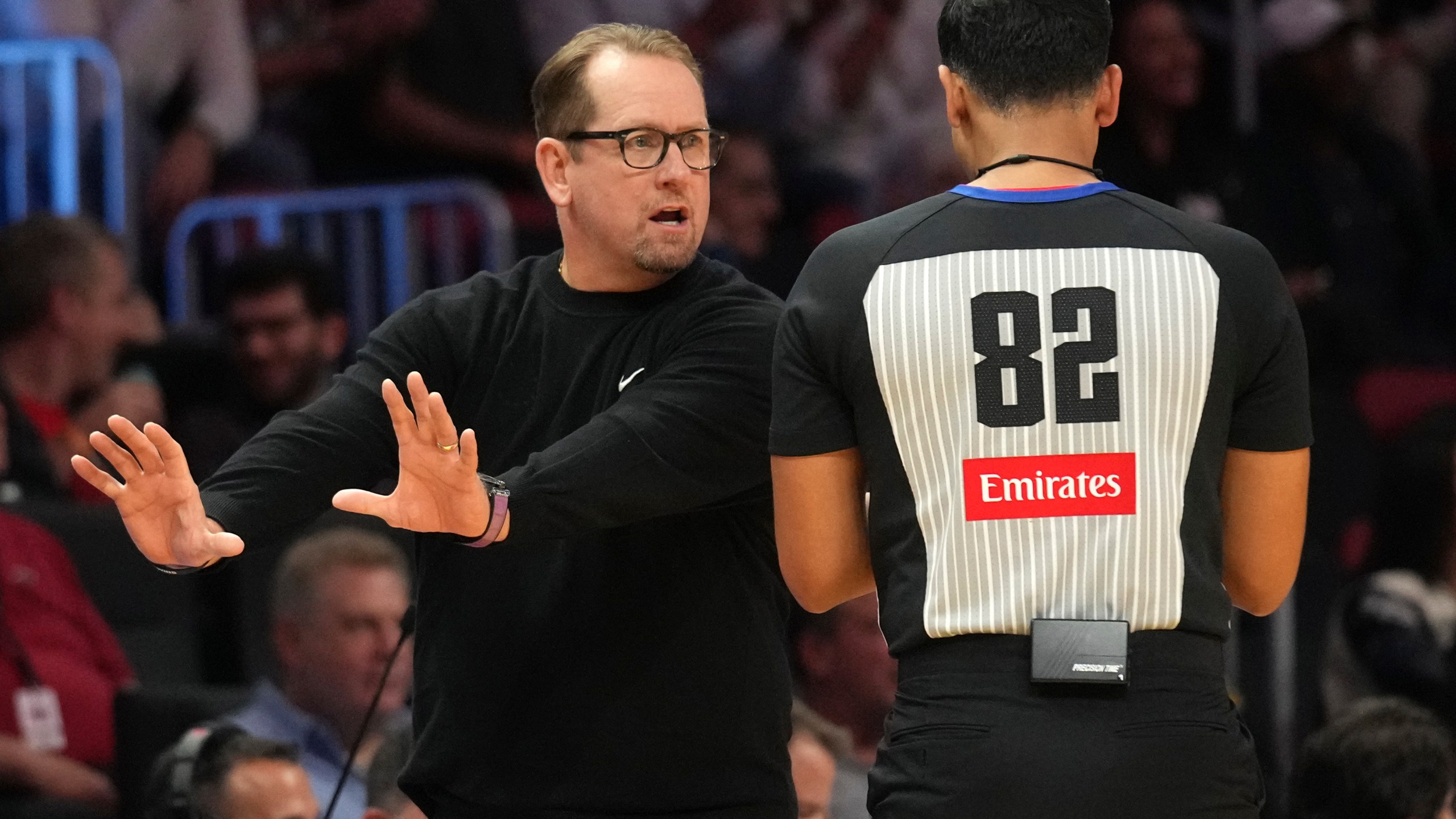 Philadelphia 76ers head coach Nick Nurse, left, talks with official Suyash Mehta (82) during the second half of an NBA basketball game against the Miami Heat, Monday, Nov. 18, 2024, in Miami. (AP Photo/Lynne Sladky)