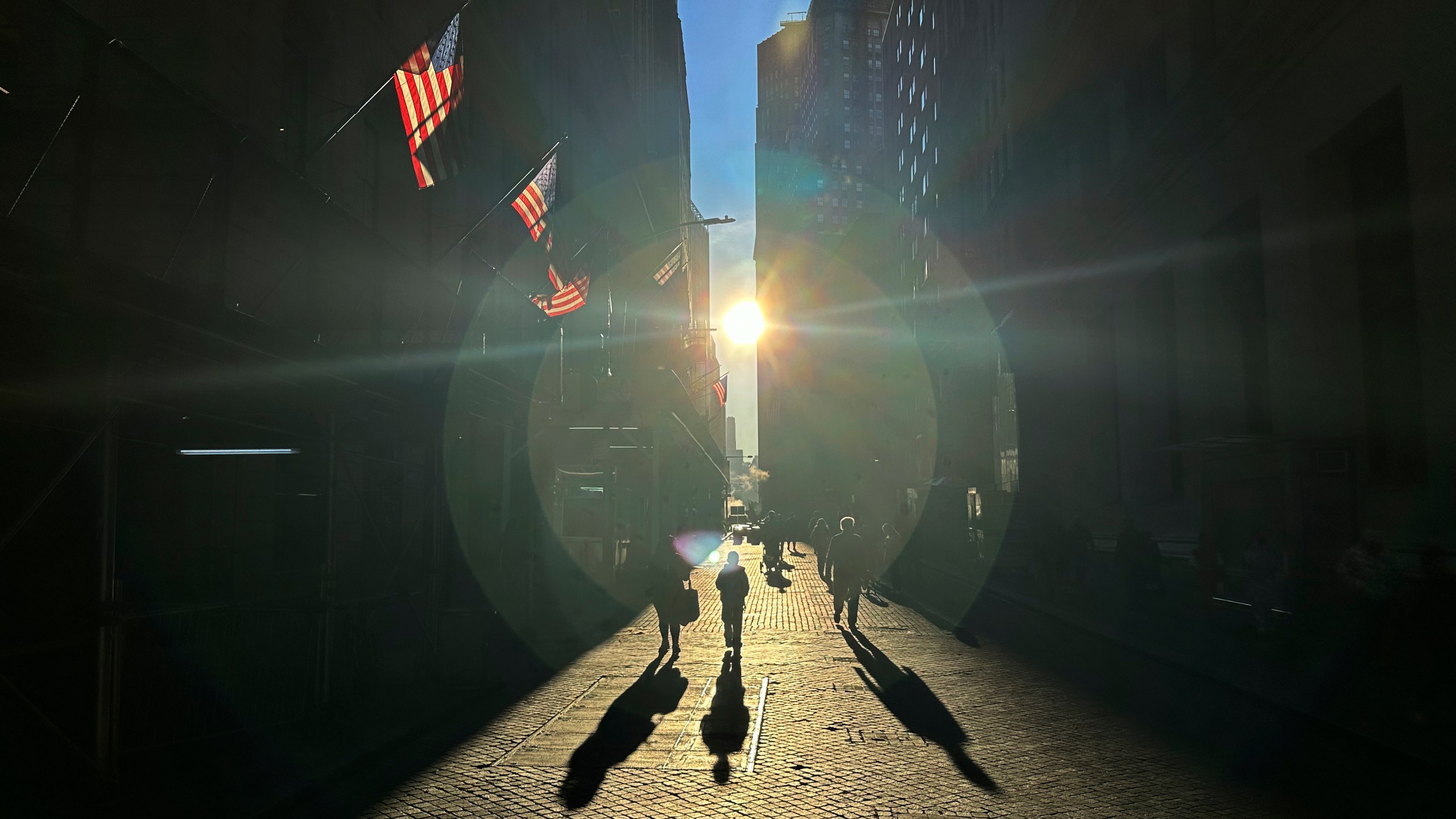 FILE - The morning sun shines on Wall Street in New York's Financial District on Tuesday, Nov. 19, 2024. (AP Photo/Peter Morgan)