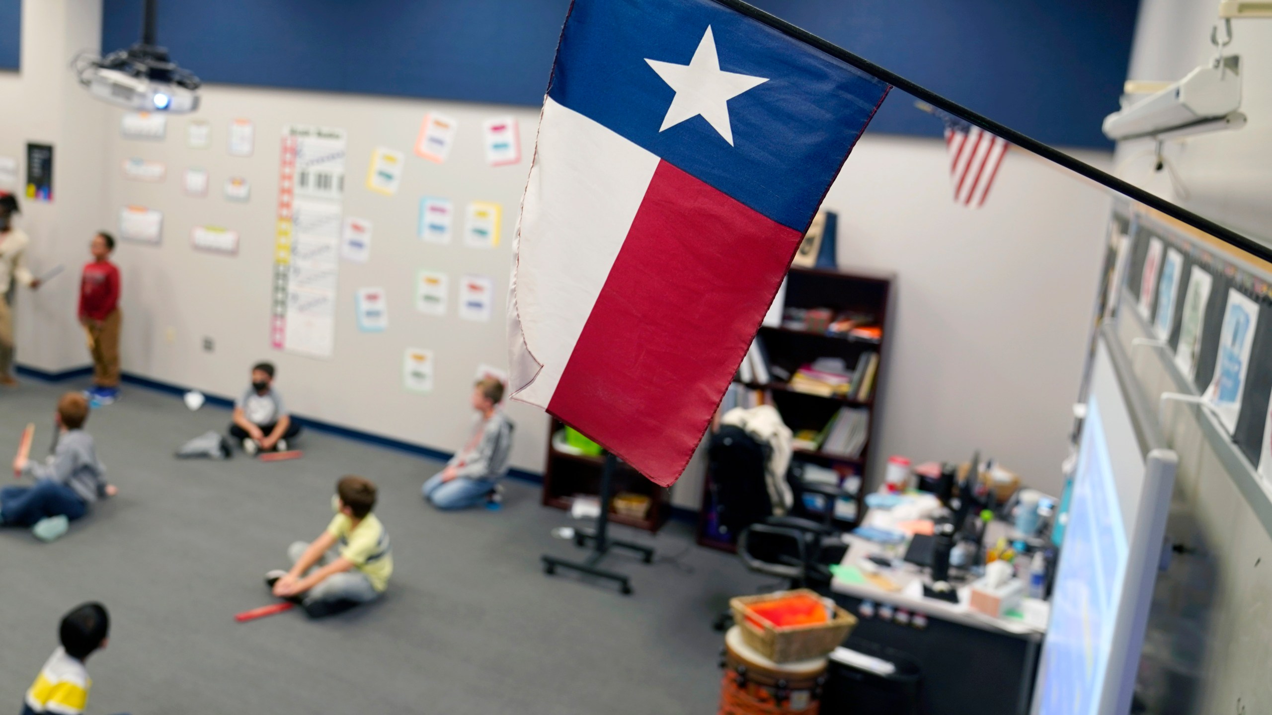 FILE - A Texas flag is displayed in an elementary school in Murphy, Texas, Thursday, Dec. 3, 2020. (AP Photo/LM Otero, File)