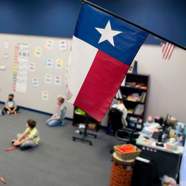 FILE - A Texas flag is displayed in an elementary school in Murphy, Texas, Thursday, Dec. 3, 2020. (AP Photo/LM Otero, File)