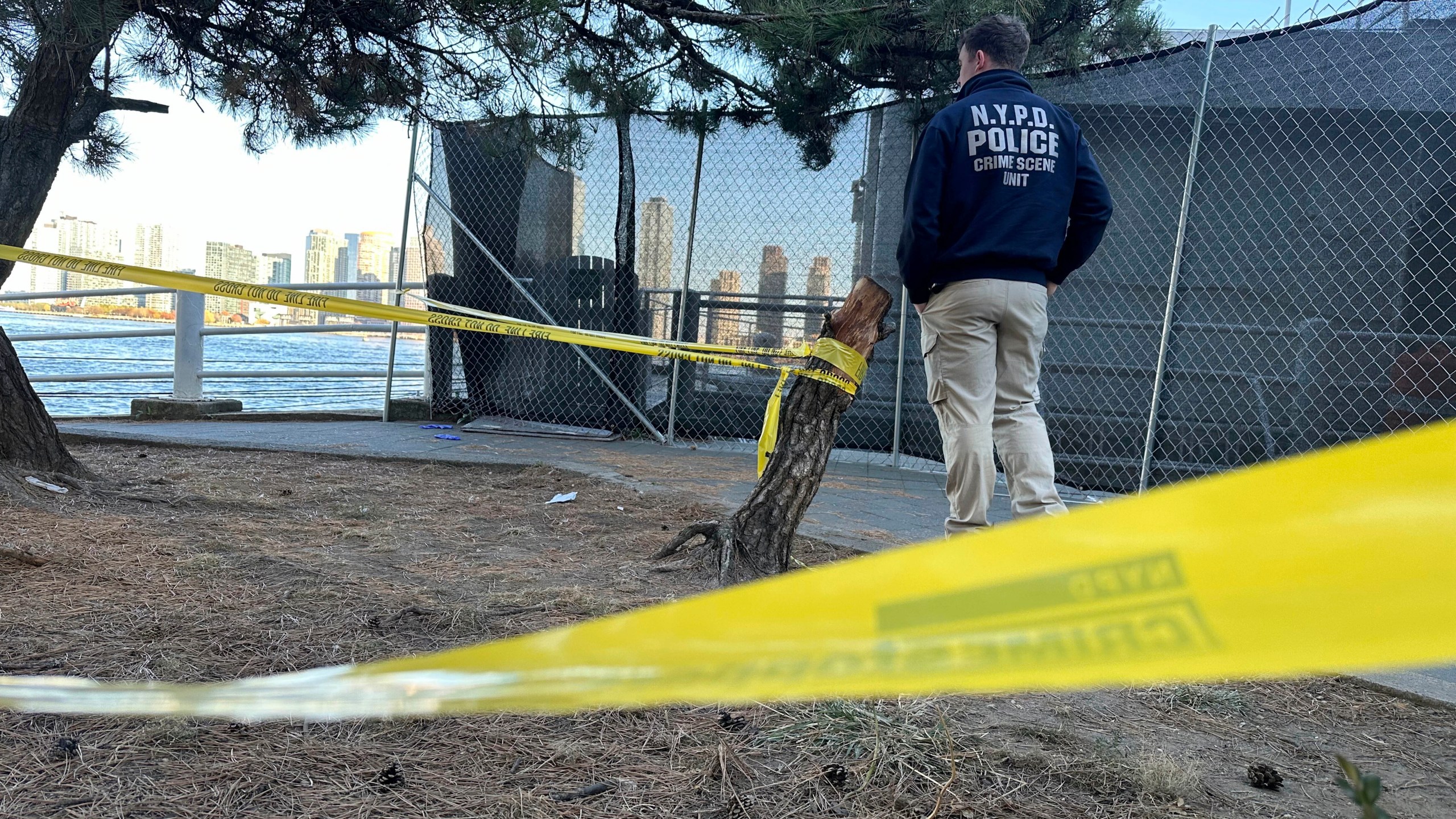 An NYPD officer works at the scene of a stabbing in New York, Monday, Nov. 18, 2024. (AP Photo/David R. Martin)