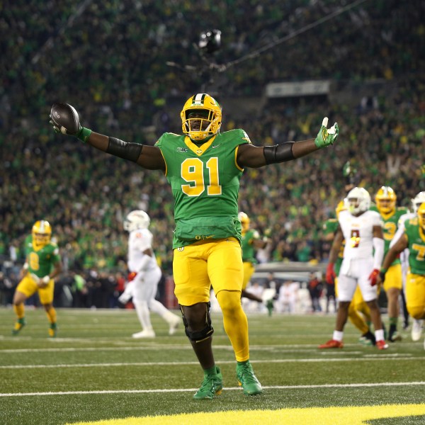 Oregon offensive lineman Gernorris Wilson (91) celebrates his touchdown reception during an NCAA college football game against Maryland, Saturday, Nov. 9, 2024, in Eugene, Ore. (AP Photo/Lydia Ely)