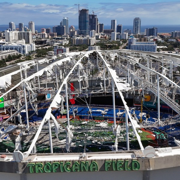 FILE - The roof of the Tropicana Field is damaged the morning after Hurricane Milton hit the region, Thursday, Oct. 10, 2024, in St. Petersburg, Fla. (AP Photo/Mike Carlson, File)