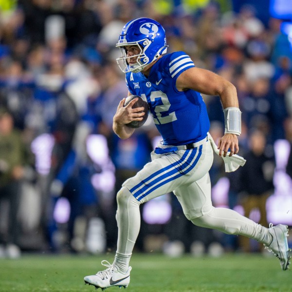 BYU quarterback Jake Retzlaff runs on a quarterback keeper, during the first half of an NCAA college football game Saturday, Nov. 16, 2024, in Provo. (AP Photo/Rick Egan)