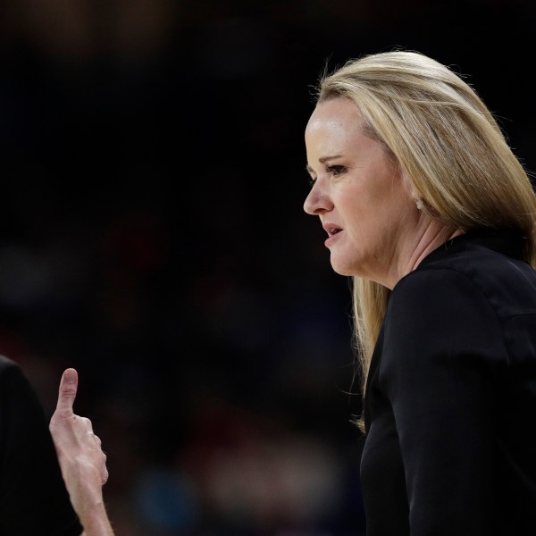 FILE - Utah head coach Lynne Roberts, right, speaks with an official during the second half of a second-round college basketball game against Gonzaga in the NCAA Tournament in Spokane, Wash., March 25, 2024. (AP Photo/Young Kwak, File)