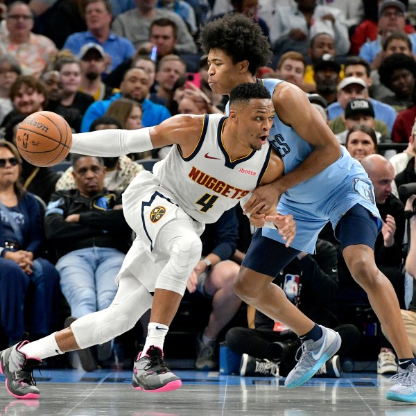 Denver Nuggets guard Russell Westbrook (4) drives against Memphis Grizzlies forward Jaylen Wells in the first half of an Emirates NBA Cup basketball game Tuesday, Nov. 19, 2024, in Memphis, Tenn. (AP Photo/Brandon Dill)