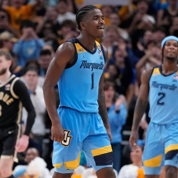 Marquette's Kam Jones reacts during the second half of an NCAA college basketball game against Purdue Tuesday, Nov. 19, 2024, in Milwaukee. Marquette won 76-58. (AP Photo/Morry Gash)