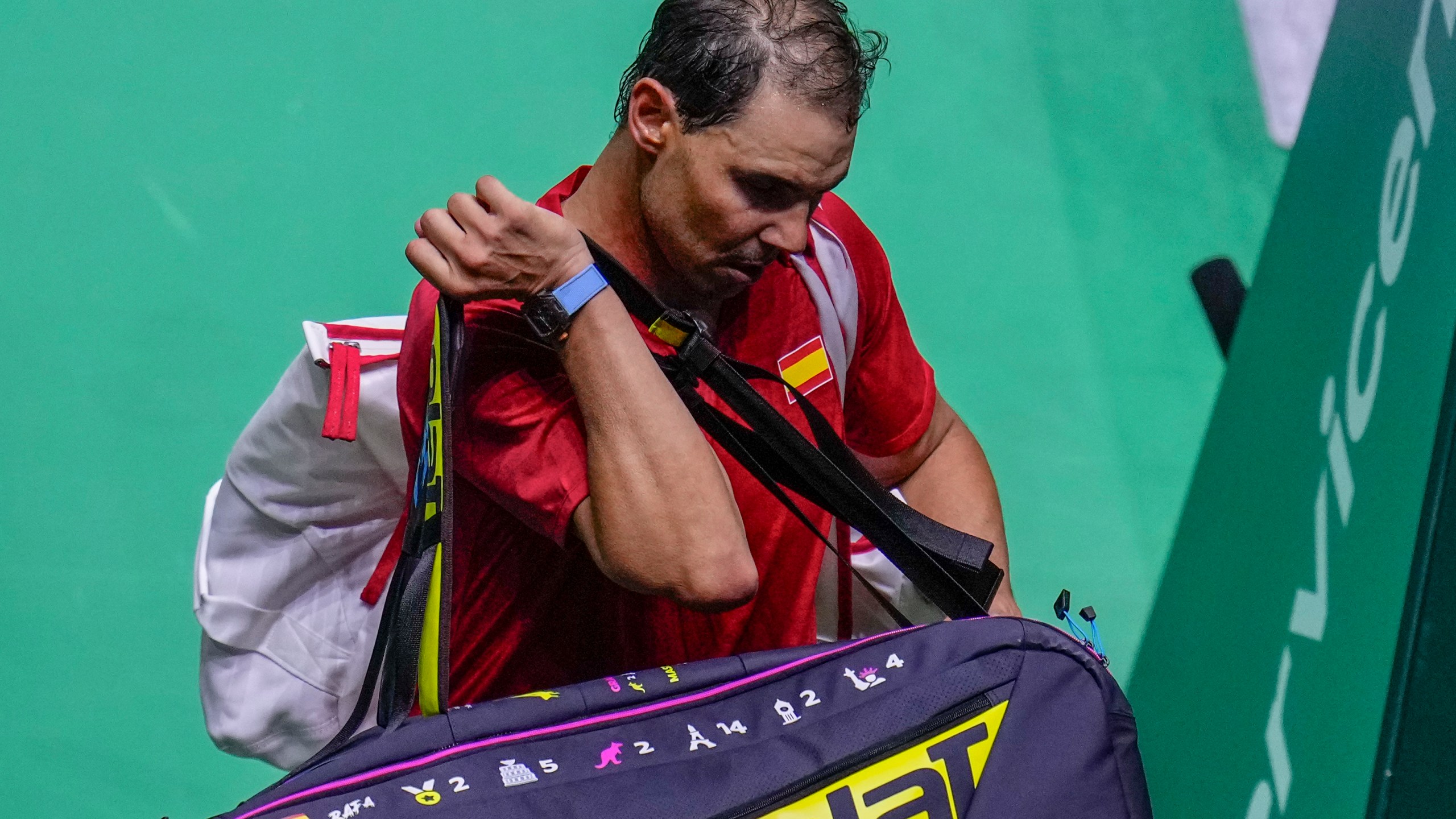 Spain's tennis player Rafael Nadal leaves the court after losing against Netherlands' Botic Van De Zandschulp during a Davis Cup quarterfinal match at Martin Carpena Sports Hall in Malaga, southern Spain, on Tuesday, Nov. 19, 2024. (AP Photo/Manu Fernandez)