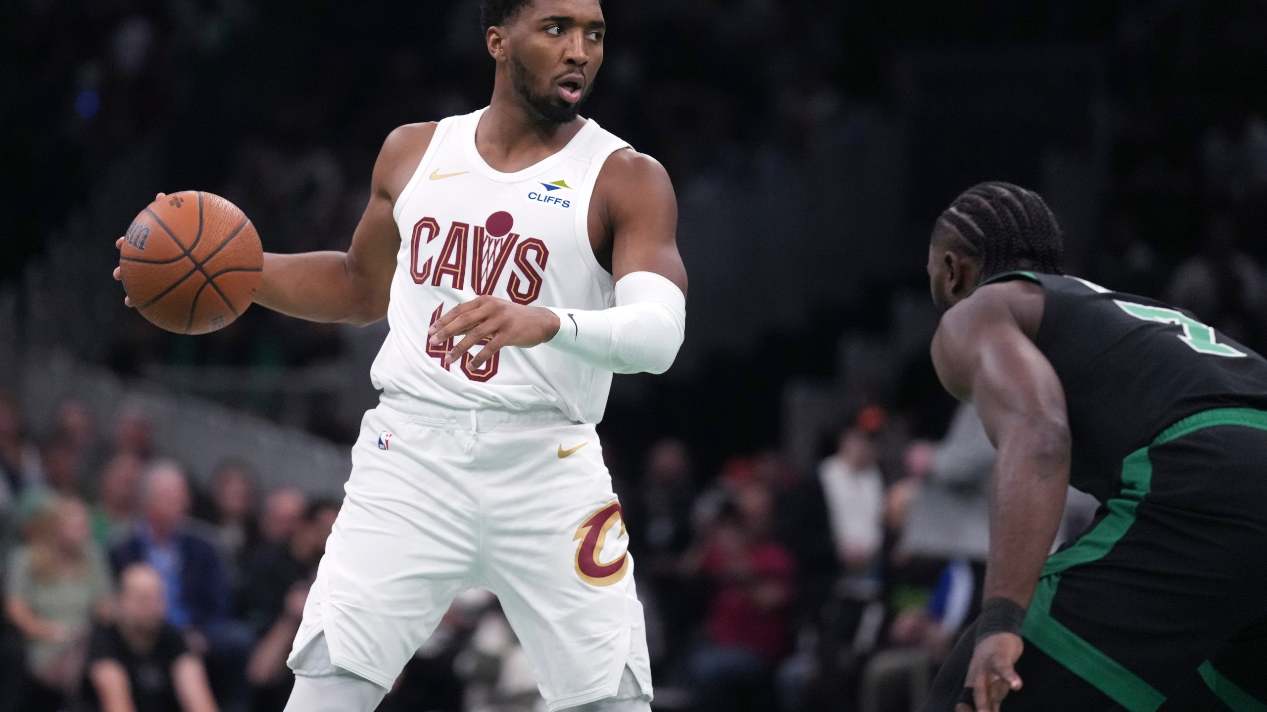 Cleveland Cavaliers guard Donovan Mitchell (45) sets to drive against Boston Celtics guard Jaylen Brown (7) during the first half of an Emirates NBA Cup basketball game, Tuesday, Nov. 19, 2024, in Boston. (AP Photo/Charles Krupa)