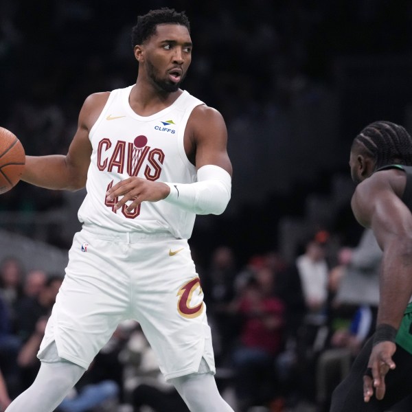 Cleveland Cavaliers guard Donovan Mitchell (45) sets to drive against Boston Celtics guard Jaylen Brown (7) during the first half of an Emirates NBA Cup basketball game, Tuesday, Nov. 19, 2024, in Boston. (AP Photo/Charles Krupa)