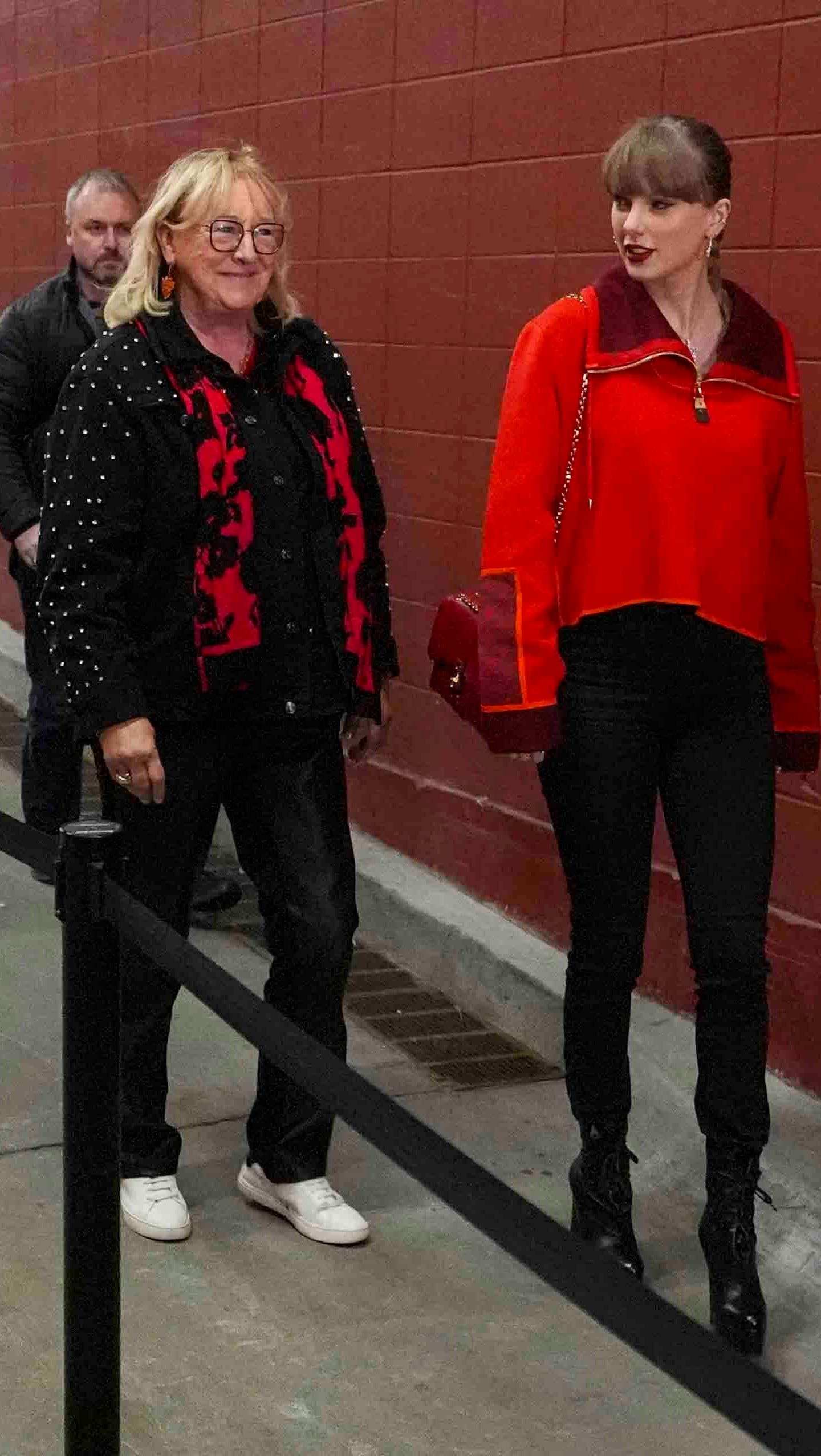 Singer Taylor Swift, right, and Donna Kelce arrive before the start of an NFL football game between the Las Vegas Raiders and the Kansas City Chiefs in Kansas City, Mo., Friday, Nov. 29, 2024. (AP Photo/Charlie Riedel)