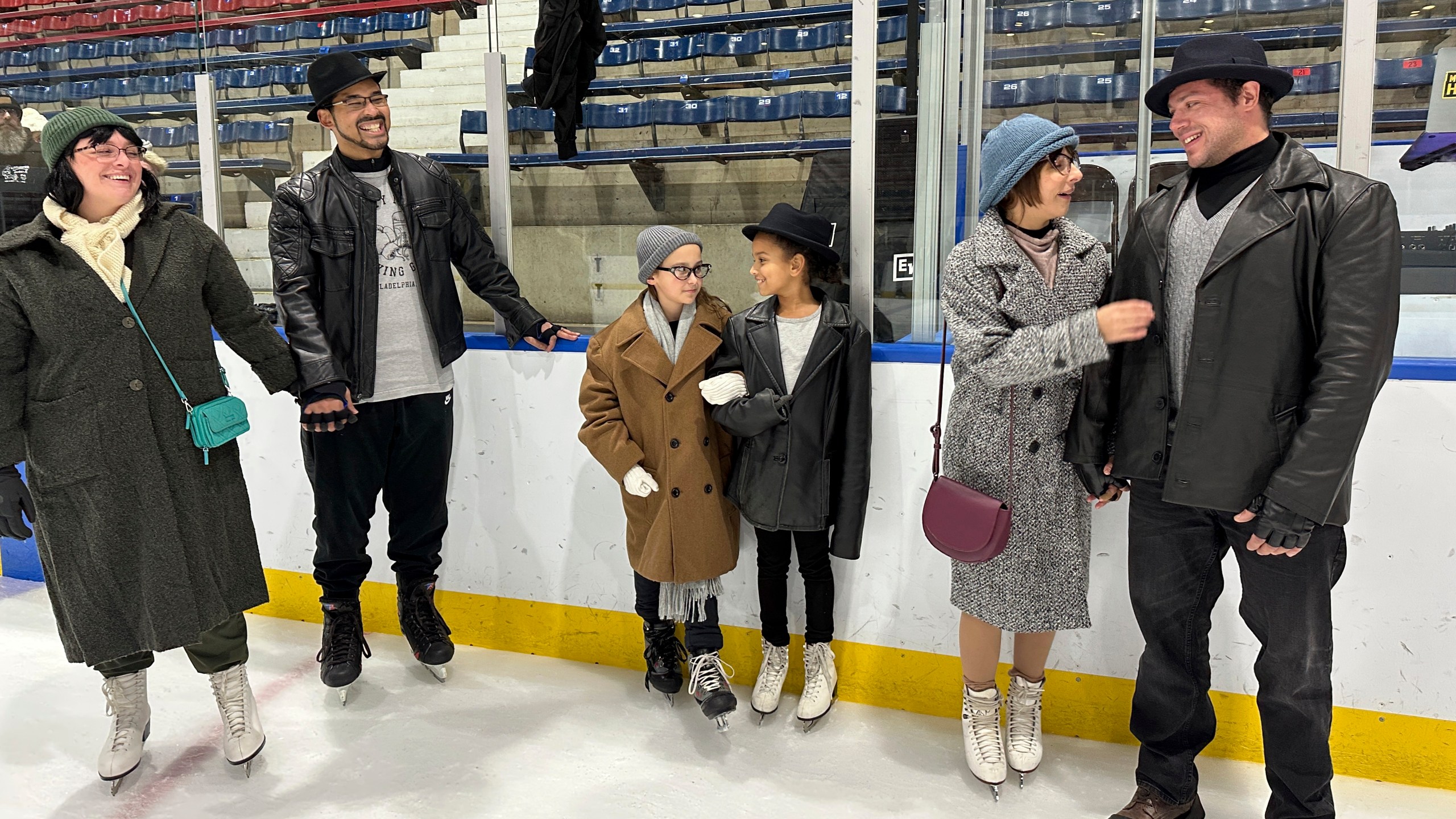 Contestants of the Rocky and Adrian look-alike stand on Penn Ice Rink during RockyFest in Philadelphia, Friday, Dec. 6, 2024. (AP Photo/Tassanee Vejpongsa)