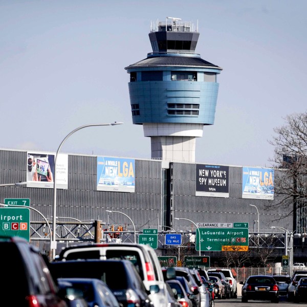 FILE - In this Friday Jan. 25, 2019, file photo is the air traffic control tower at LaGuardia Airport in New York. (AP Photo/Julio Cortez, File)