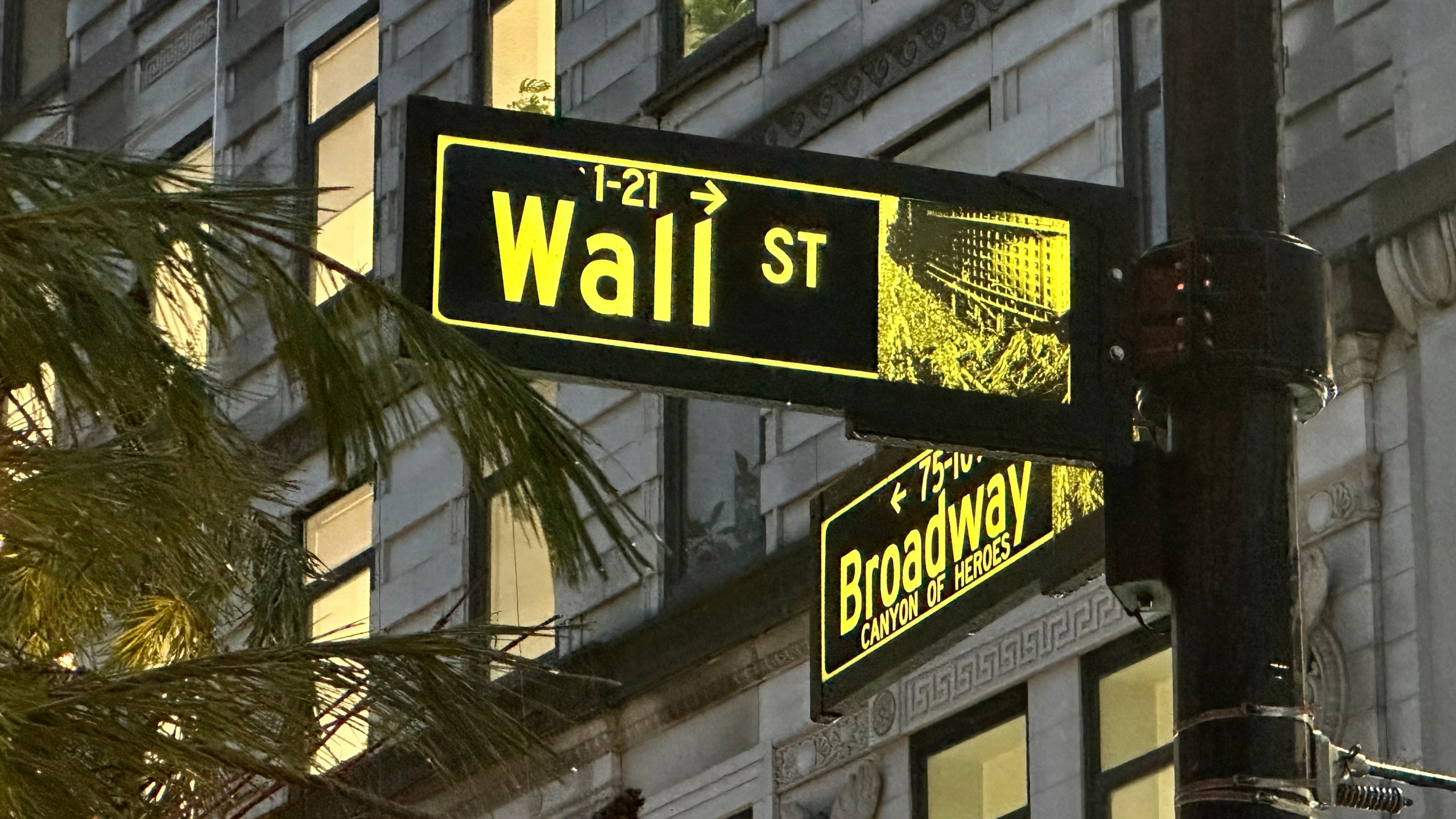 Signs mark the intersection of Wall Street and Broadway in New York's Financial District on Wednesday Dec.11, 2024. (AP Photo/Peter Morgan)