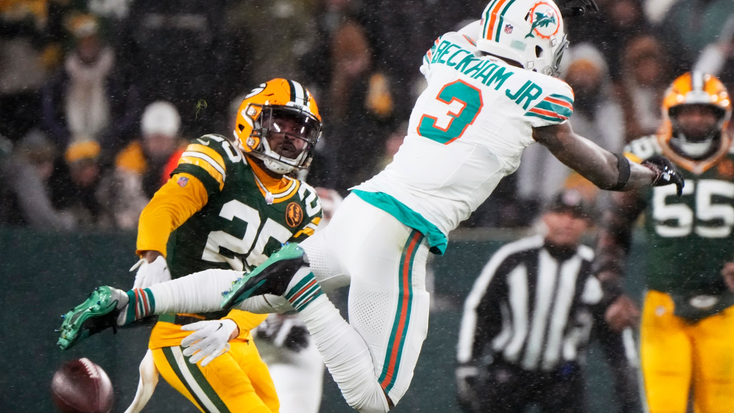 Green Bay Packers cornerback Keisean Nixon (25) breaks up a pass intended for Miami Dolphins wide receiver Odell Beckham Jr. (3) during the second half of an NFL football game Thursday, Nov. 28, 2024, in Green Bay, Wis. (AP Photo/Morry Gash)