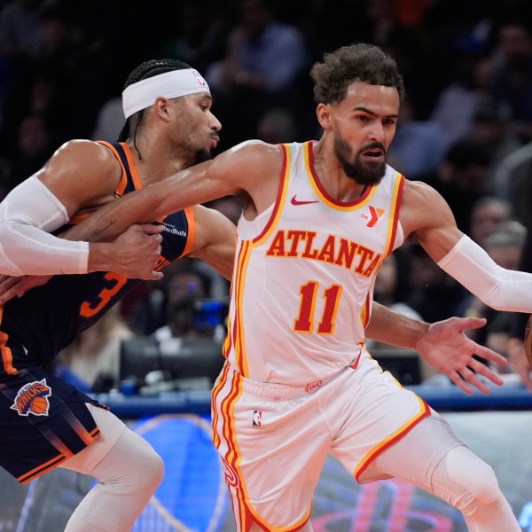 Atlanta Hawks' Trae Young (11) drives past New York Knicks' Josh Hart (3) during the first half of an Emirates NBA Cup basketball game Wednesday, Dec. 11, 2024, in New York. (AP Photo/Frank Franklin II)