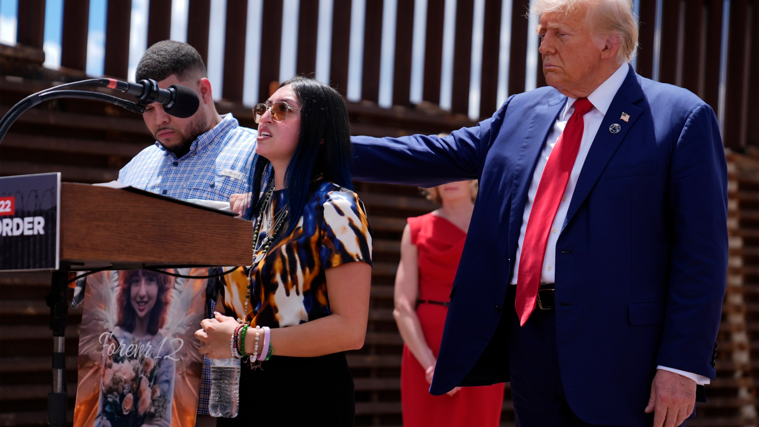 FILE - Republican presidential nominee former President Donald Trump comforts Alexis Nungaray and Joamel Guevara, mother and uncle of Jocelyn Nungaray, during an event along the southern border with Mexico, Thursday, Aug. 22, 2024, in Sierra Vista, Ariz. (AP Photo/Evan Vucci, File)