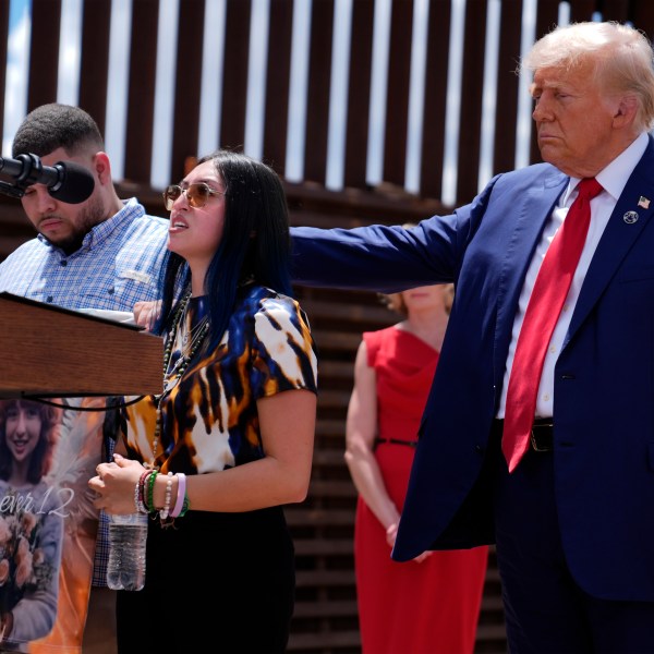 FILE - Republican presidential nominee former President Donald Trump comforts Alexis Nungaray and Joamel Guevara, mother and uncle of Jocelyn Nungaray, during an event along the southern border with Mexico, Thursday, Aug. 22, 2024, in Sierra Vista, Ariz. (AP Photo/Evan Vucci, File)