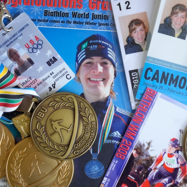 Biathlon competition medals, credentials, and media clippings belonging to Grace Boutot, silver medalist in Youth World Championships in 2009, are displayed for a photograph at her home, Oct. 17, 2024, in Boston. (AP Photo/Steven Senne)