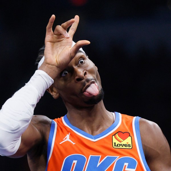 Oklahoma City Thunder guard Shai Gilgeous-Alexander (2) sticks his tongue out while celebrating a 3-pointer during the first half of an Emirates NBA Cup basketball game against the Dallas Mavericks, Tuesday, Dec. 10, 2024, in Oklahoma City. (AP Photo/Nate Billings)