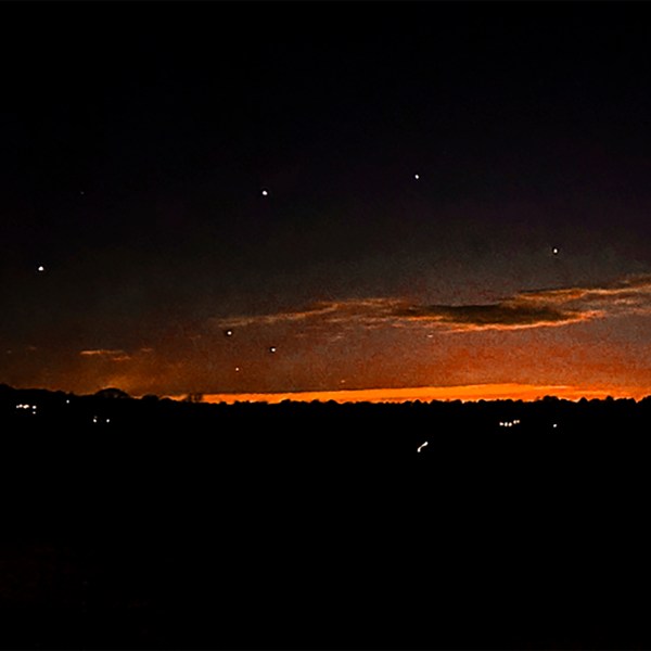 This photo provided by Trisha Bushey shows the evening sky and points of light near in Lebanon Township, N.J., on Thursday, Dec. 5, 2024. (Trisha Bushey via AP)