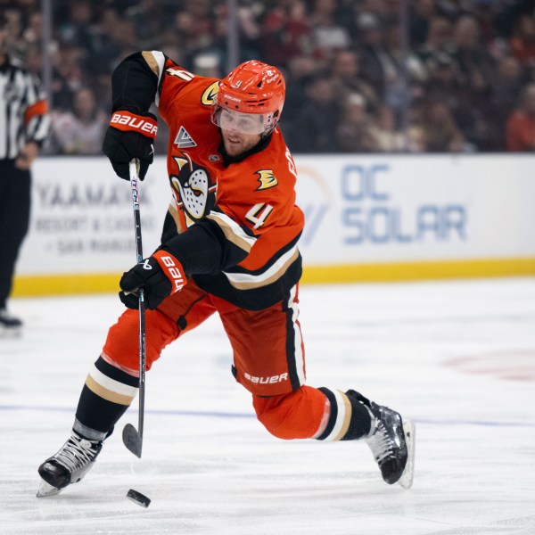 Anaheim Ducks defenseman Cam Fowler (4) shoots during the third period of an NHL hockey game against the Minnesota Wild, Friday, Dec. 6, 2024, in Anaheim, Calif. (AP Photo/Kyusung Gong)