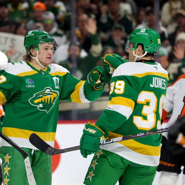 Minnesota Wild left wing Kirill Kaprizov, left, celebrates his goal with center Ben Jones (39) during the first period of an NHL hockey game against the Philadelphia Flyers, Saturday, Dec. 14, 2024, in St. Paul, Minn. (AP Photo/Ellen Schmidt)