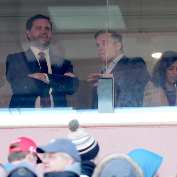 Vice President-elect JD Vance, from left, and Senator-elect Dave McCormick, R-Pa., speak as Usha Vance looks on at the NCAA college football game between Army and Navy at Northwest Stadium in Landover, Md., Saturday, Dec. 14, 2024. (AP Photo/Stephanie Scarbrough)