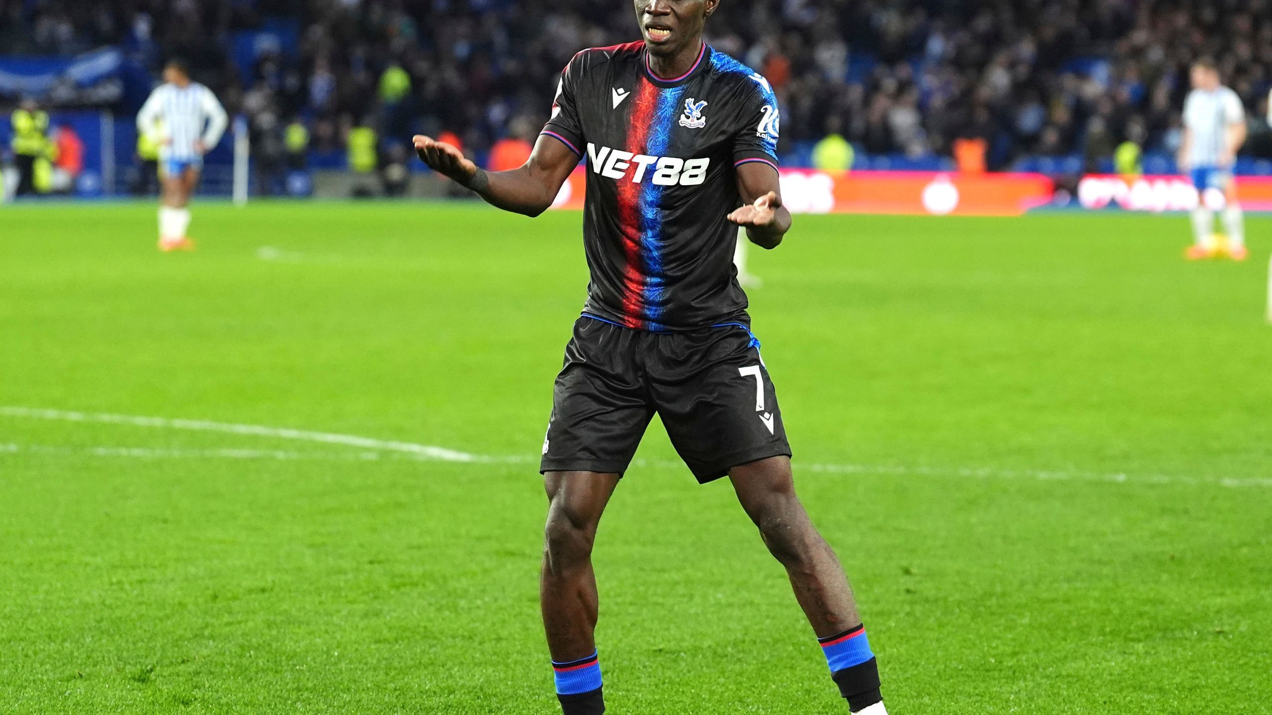 Crystal Palace's Ismaila Sarr celebrates scoring during the English Premier League soccer match between Brighton and Hove Albion and Crystal Palace, at the American Express Stadium, in Brighton and Hove, England, Sunday, Dec. 15, 2024. (Zac Goodwin/PA via AP)