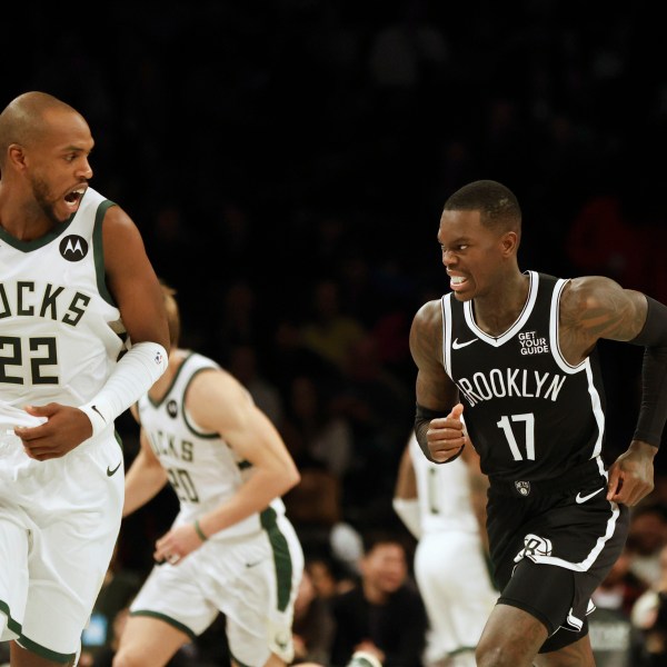 Brooklyn Nets' Dennis Schroder reacts after scoring during the first half of an NBA basketball game against the Milwaukee Bucks, Sunday, Dec. 8, 2024, in New York. (AP Photo/Heather Khalifa)