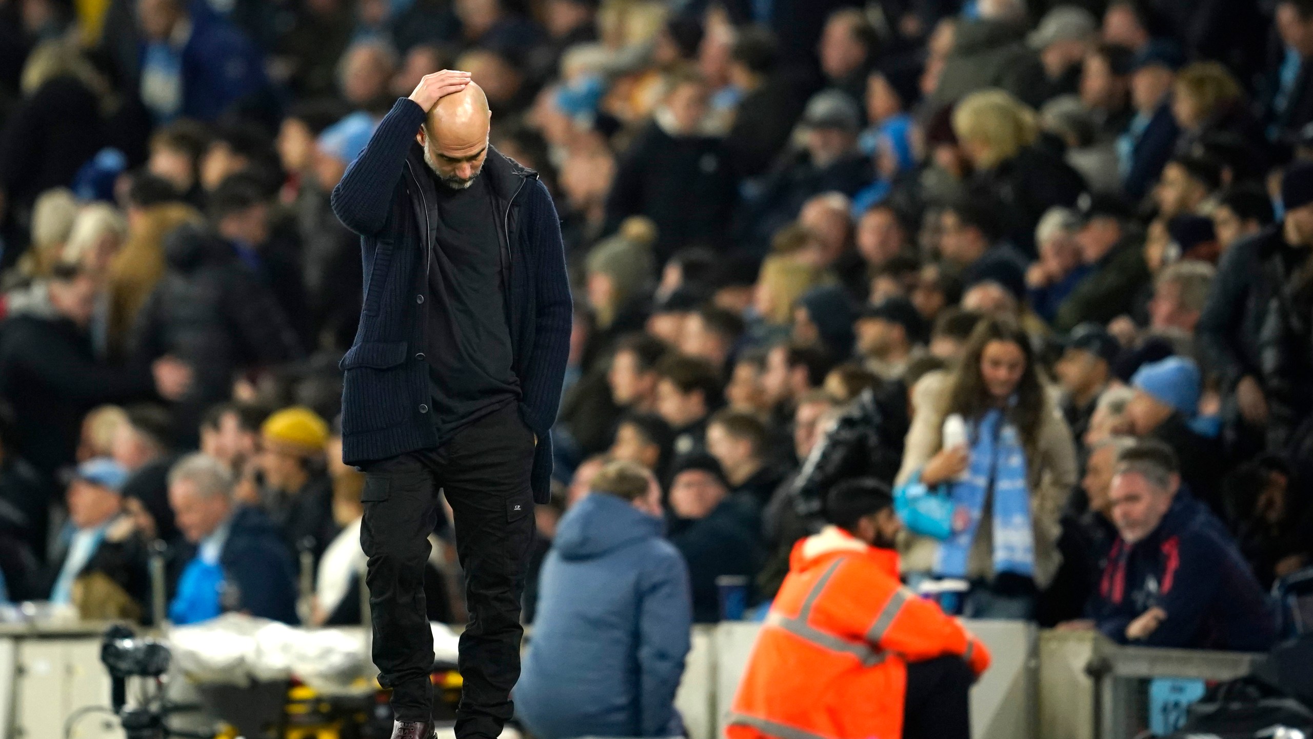 Manchester City's head coach Pep Guardiola reacts during the English Premier League soccer match between Manchester City and Manchester United at the Etihad Stadium in Manchester, Sunday, Dec. 15, 2024. (AP Photo/Dave Thompson)