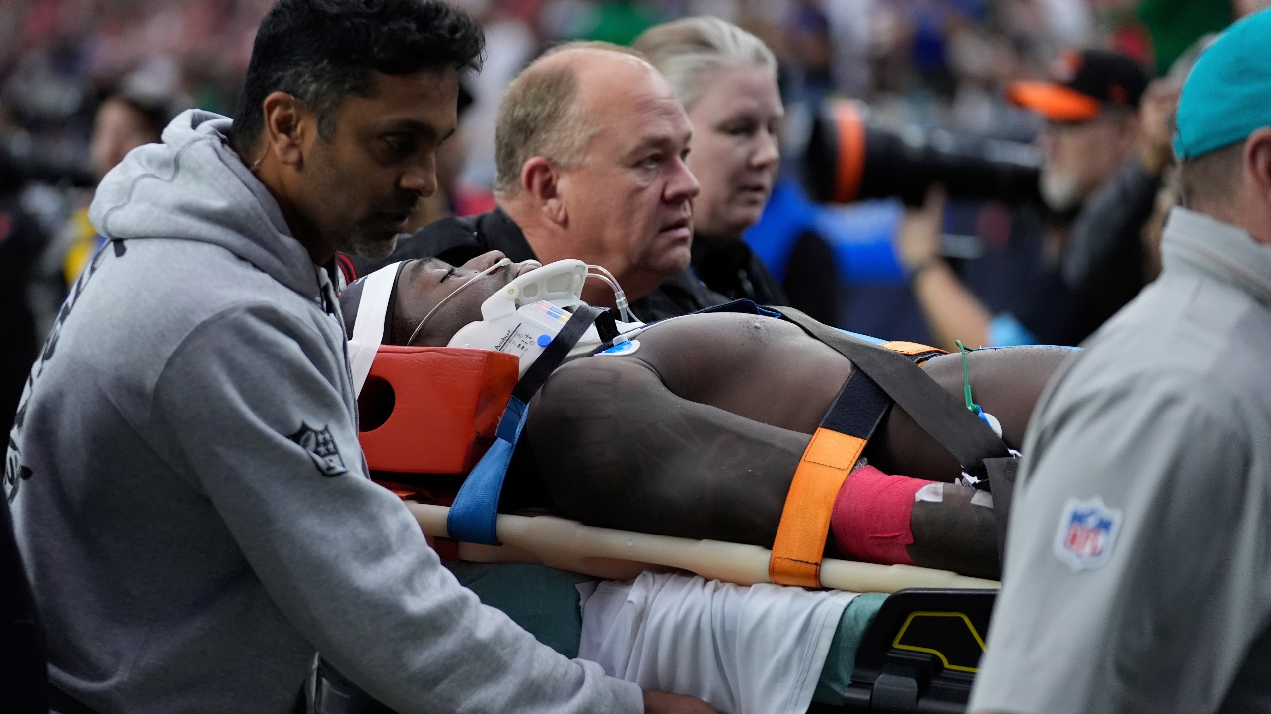 Miami Dolphins wide receiver Grant DuBose (88) is carted off the field after being injured during the second half of an NFL football game against the Houston Texans, Sunday, Dec. 15, 2024, in Houston. (AP Photo/Ashley Landis)