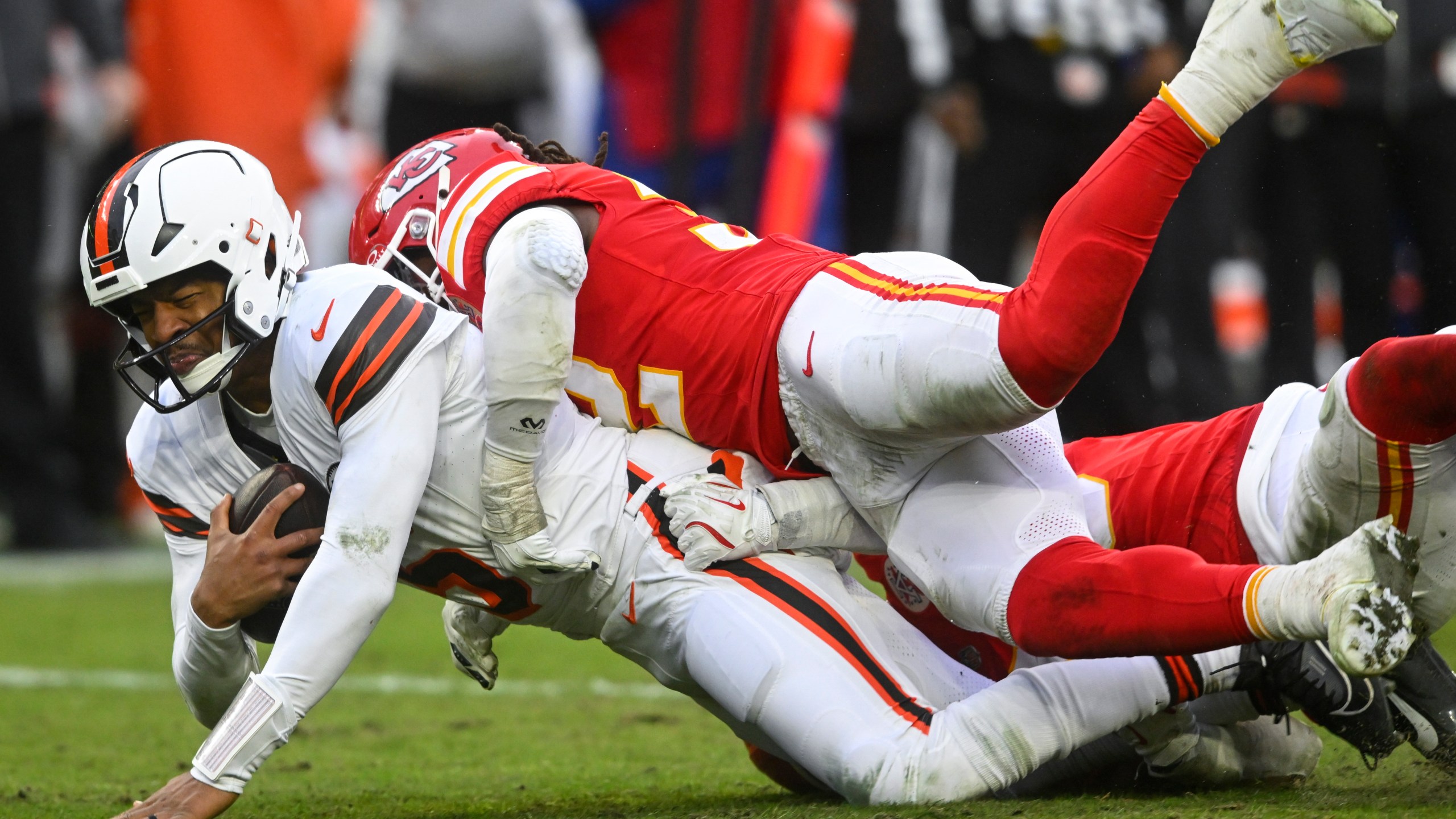 Kansas City Chiefs linebacker Nick Bolton (32) sacks Cleveland Browns quarterback Jameis Winston (5) during the second half of an NFL football game, Sunday, Dec. 15, 2024, in Cleveland. (AP Photo/David Richard)