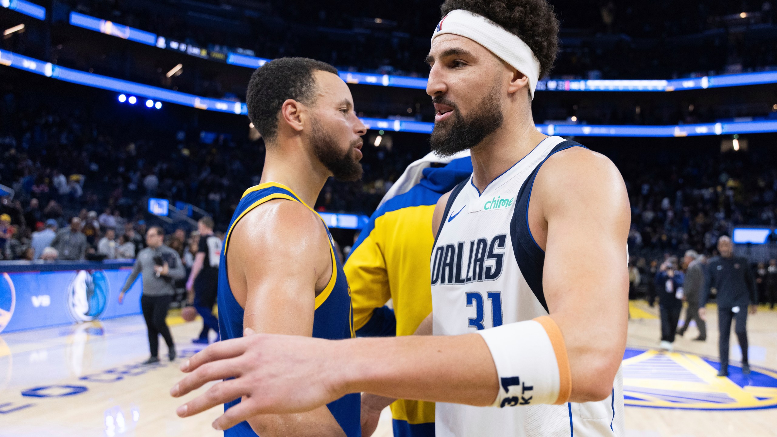 Golden State Warriors guard Stephen Curry interacts with Dallas Mavericks guard Klay Thompson (31) after an NBA basketball game Sunday, Dec. 15, 2024, in San Francisco. (AP Photo/Benjamin Fanjoy)