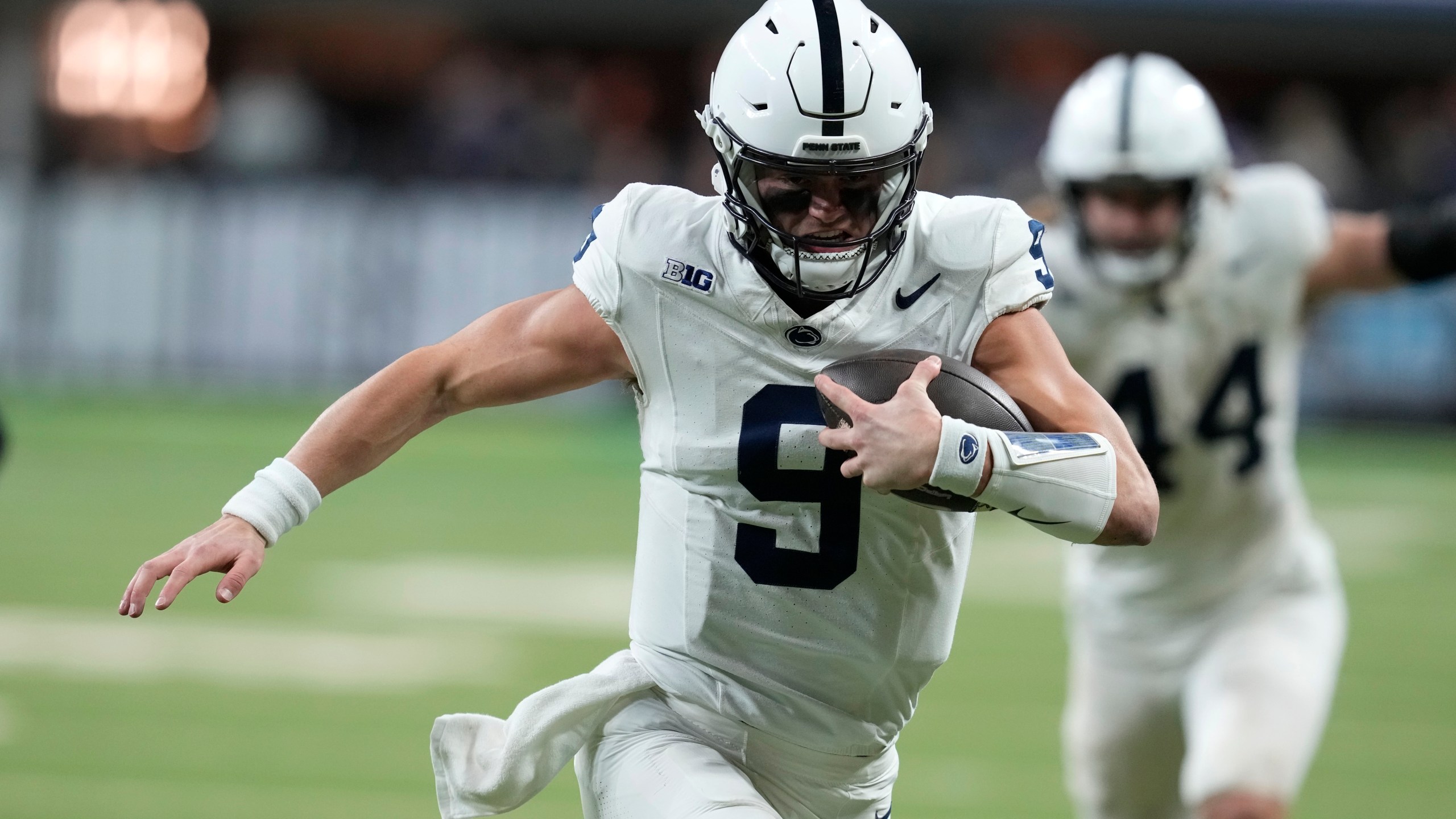 Penn State quarterback Beau Pribula (9) runs up field during the second half of the Big Ten championship NCAA college football game against Oregon, Saturday, Dec. 7, 2024, in Indianapolis. (AP Photo/Darron Cummings)