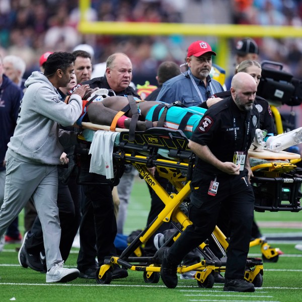 Miami Dolphins wide receiver Grant DuBose (88) is carted off the field after being injured during the second half of an NFL football game against the Houston Texans, Sunday, Dec. 15, 2024, in Houston. (AP Photo/Eric Christian Smith)