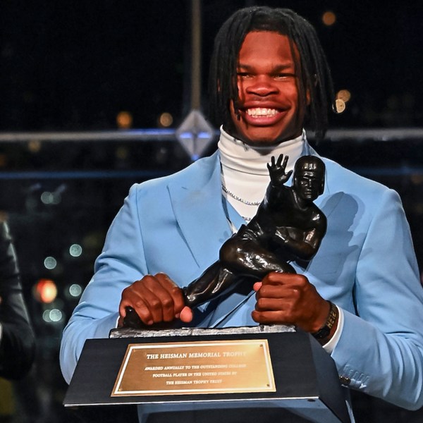 Colorado’s Travis Hunter holds the trophy after winning the Heisman Trophy as the outstanding player in college football, Saturday, Dec. 14, 2024, in New York. (Todd Van Emst/Heisman Trust via AP, Pool)