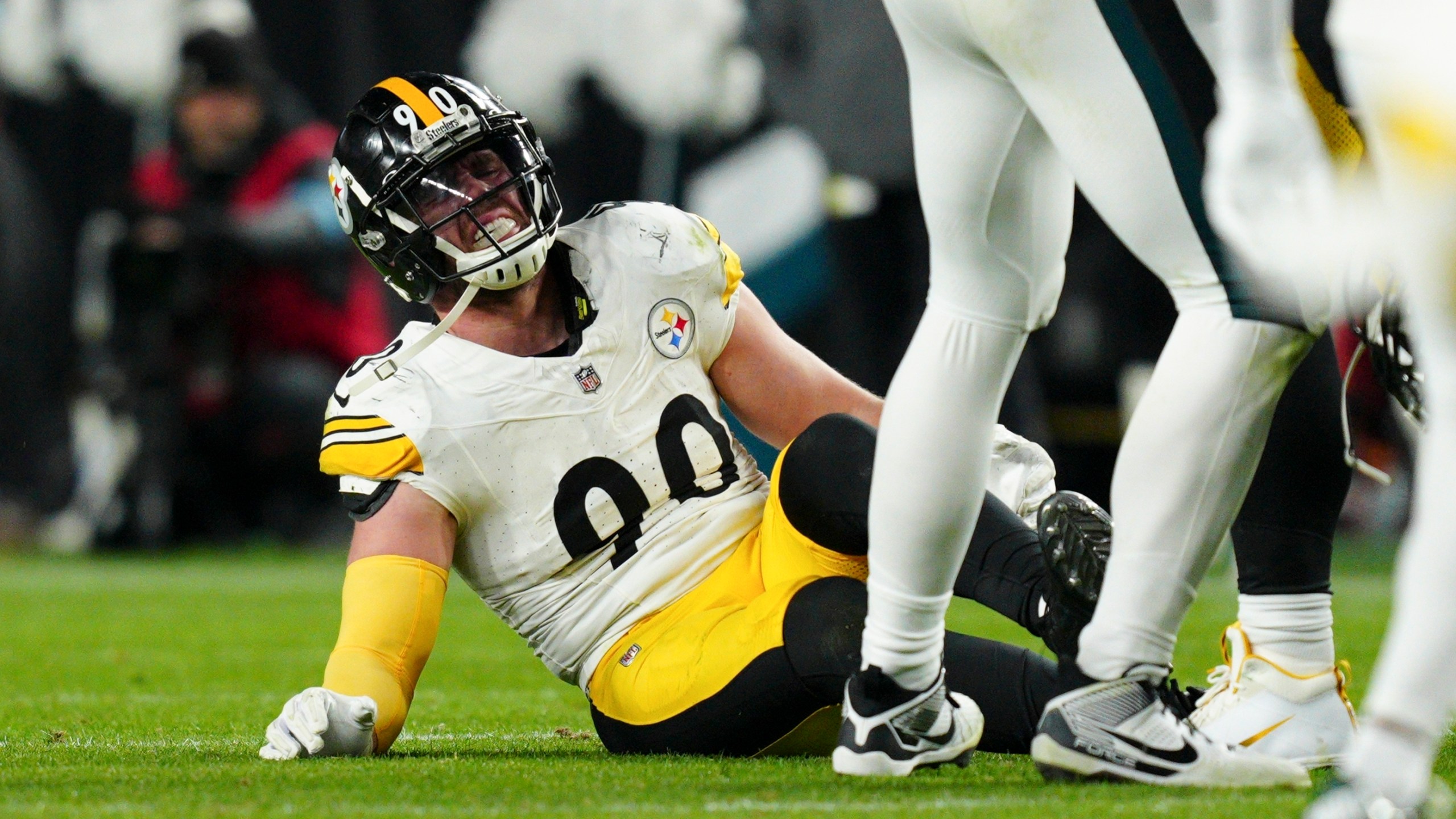 Pittsburgh Steelers linebacker T.J. Watt (90) sits on the field after an injury during the second half of an NFL football game against the Philadelphia Eagles on Sunday, Dec. 15, 2024, in Philadelphia. (AP Photo/Derik Hamilton)