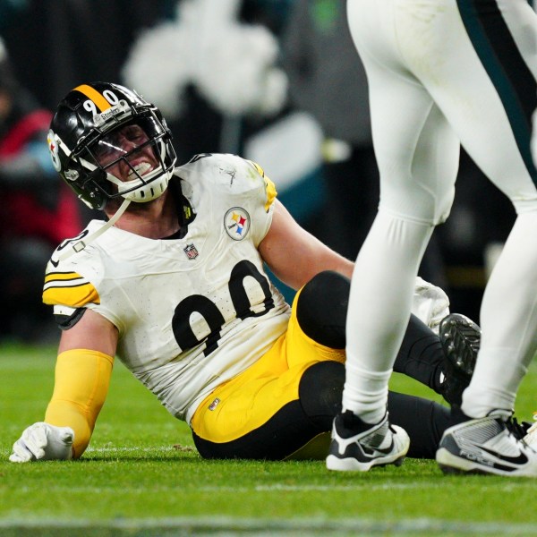 Pittsburgh Steelers linebacker T.J. Watt (90) sits on the field after an injury during the second half of an NFL football game against the Philadelphia Eagles on Sunday, Dec. 15, 2024, in Philadelphia. (AP Photo/Derik Hamilton)