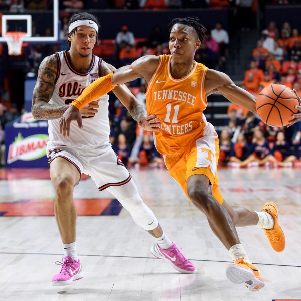 Tennessee's Jordan Gainey drives past Illinois' Tre White during an NCAA college basketball game Saturday, Dec. 14, 2024, in Champaign, Ill. (AP Photo/Craig Pessman)