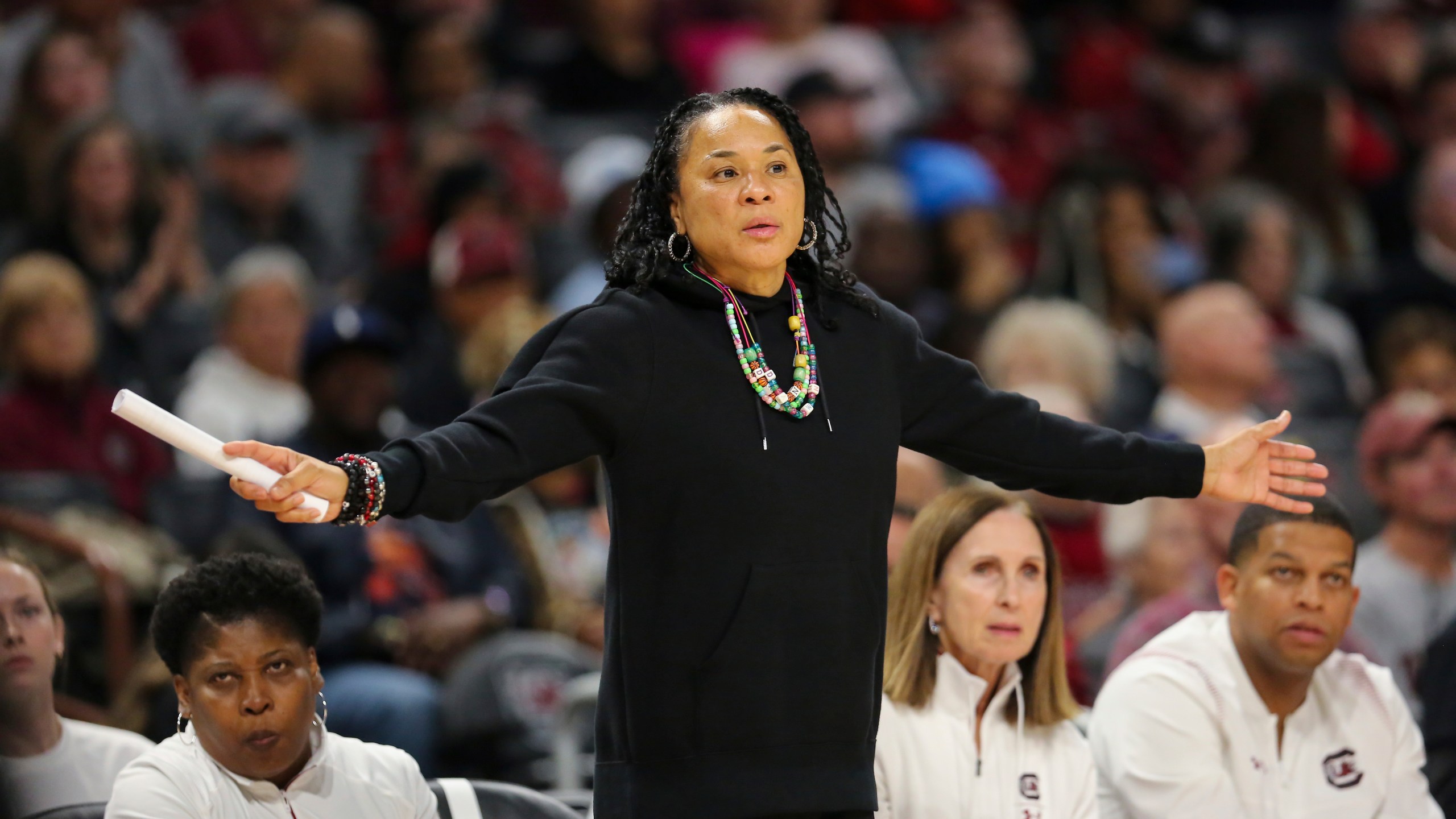 South Carolina head coach Dawn Staley her arms out for her defense to see during the second half of an NCAA college basketball game against South Florida Sunday, Dec. 15, 2024, in Columbia, S.C. (AP Photo/Artie Walker Jr.)