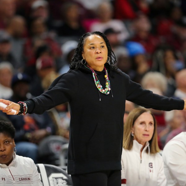 South Carolina head coach Dawn Staley her arms out for her defense to see during the second half of an NCAA college basketball game against South Florida Sunday, Dec. 15, 2024, in Columbia, S.C. (AP Photo/Artie Walker Jr.)