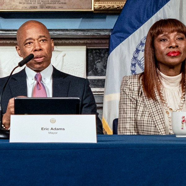 FILE — New York Mayor Eric Adams, and chief advisor to the mayor Ingrid Lewis-Martin, attend a press conference at City Hall, in New York, Tuesday, Dec. 12, 2023. (AP Photo/Peter K. Afriyie, File)