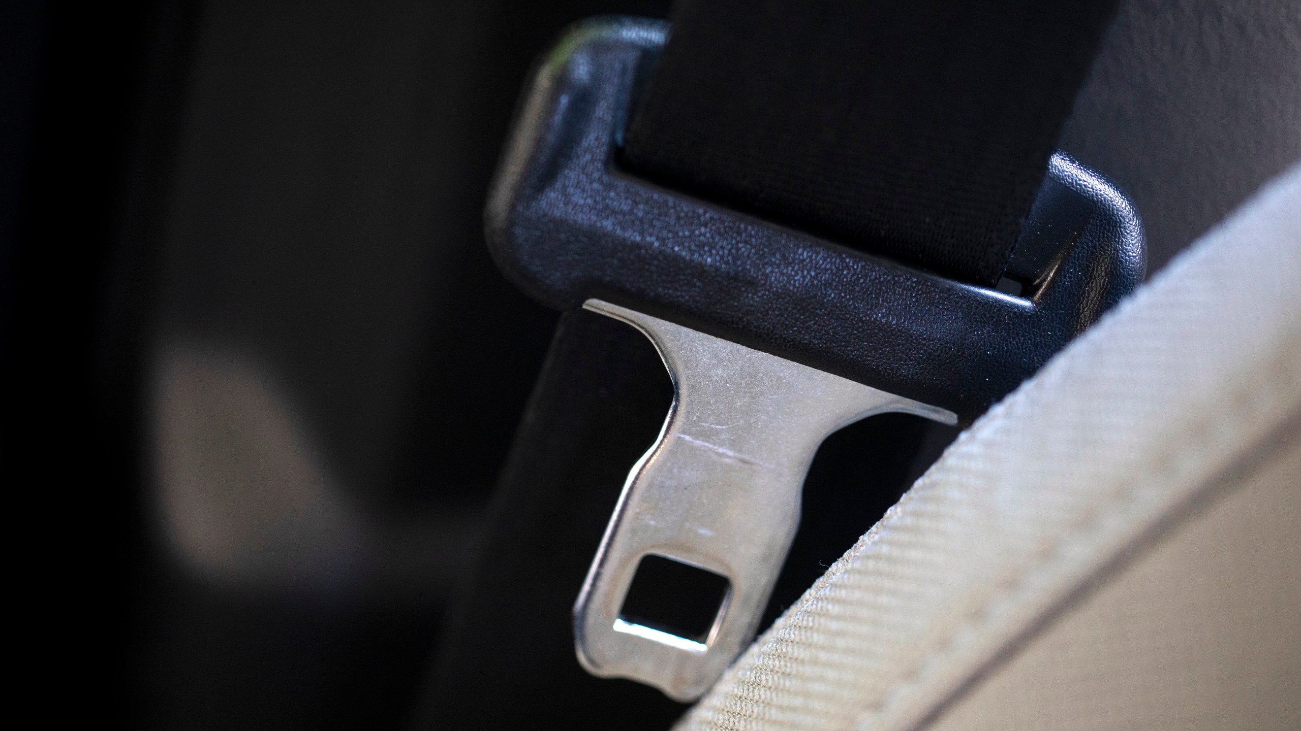 FILE - A seat belt for the right front passenger seat is shown in a vehicle on Aug. 21, 2023. (AP Photo/Jenny Kane, file)