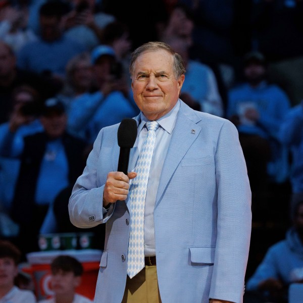 New North Carolina head football coach Bill Belichick speaks to the crowd at Dean Smith Center during halftime of an NCAA college basketball game between La Salle and North Carolina in Chapel Hill, N.C., Saturday, Dec. 14, 2024. (AP Photo/Ben McKeown)